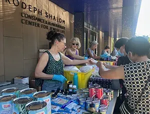 people working at breaking bread on broadway