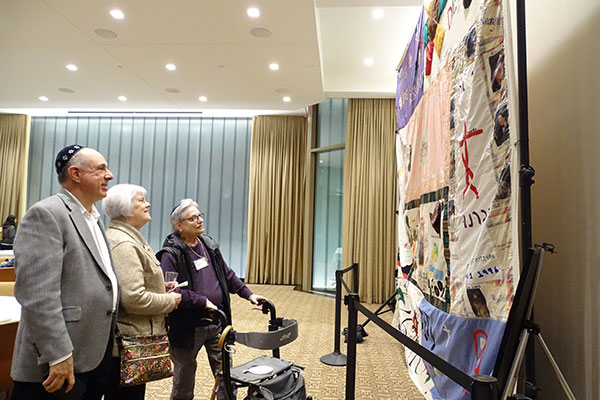 congregants viewing the AIDS Quilt