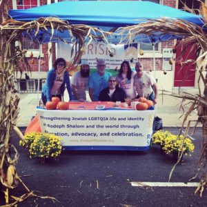 Congregants at a table at Outfest