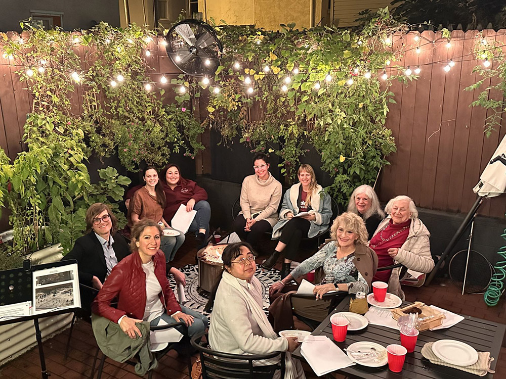 Smiling women sitting together in a meeting