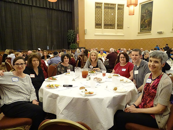 Seasoned seniors group sitting at a table