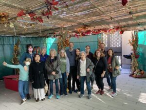 group of people under a Sukkah